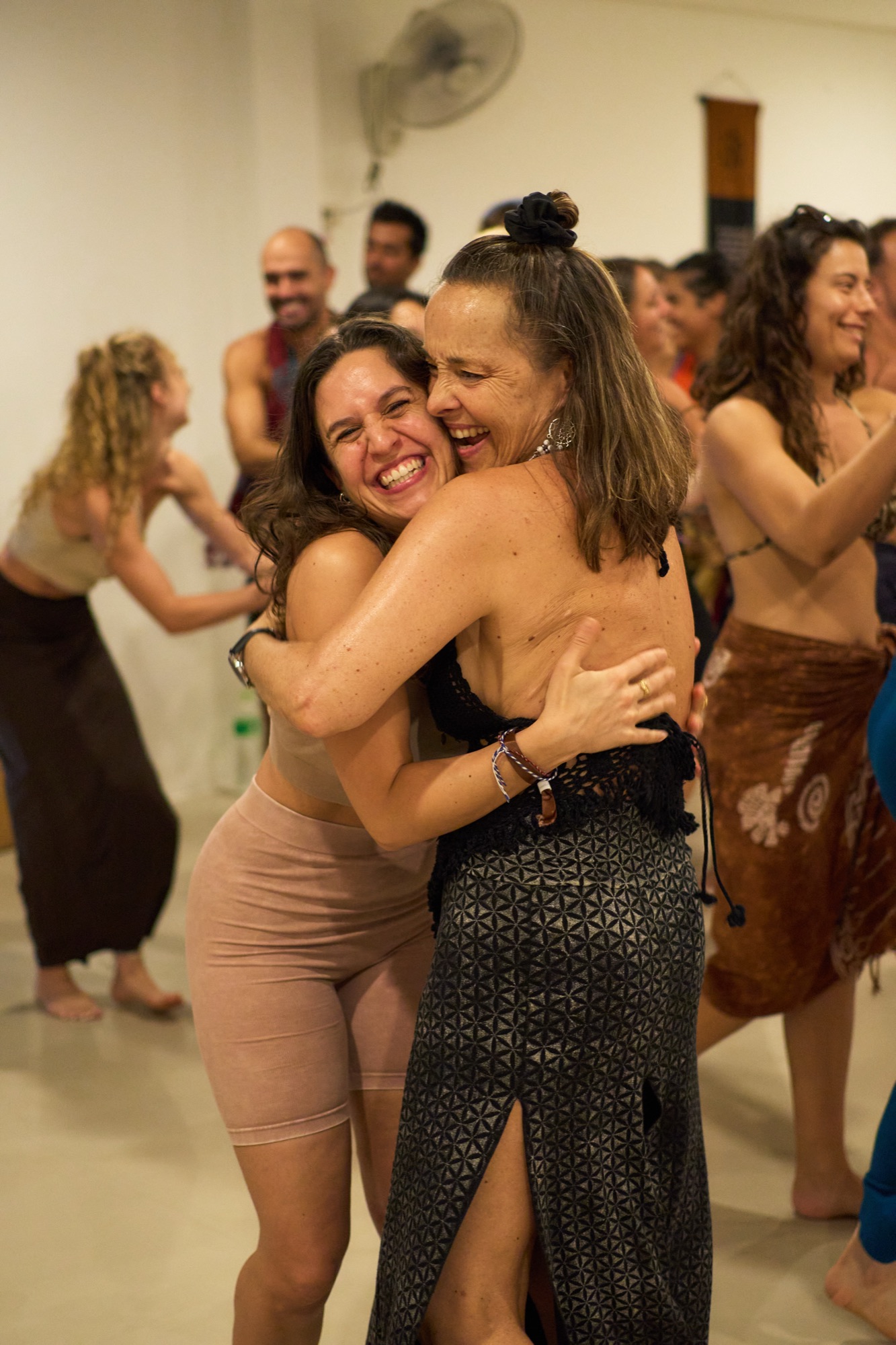 Participants embracing in connection at a BioDevelopment gathering
