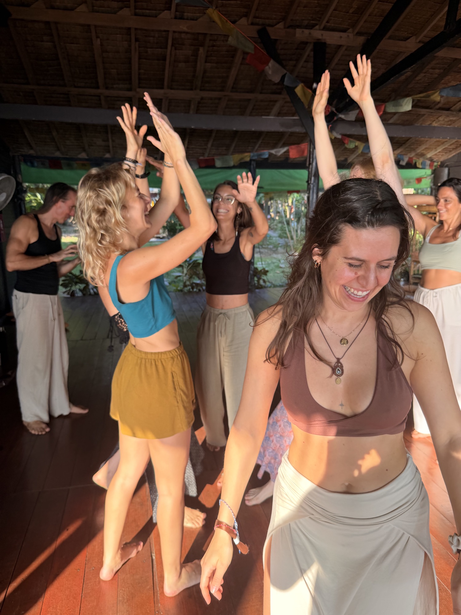 Lisa dancing with the group behind her