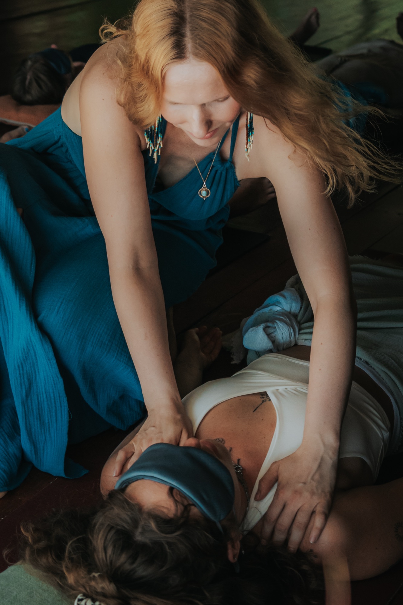 Hands on participant's shoulders - healing and integration
