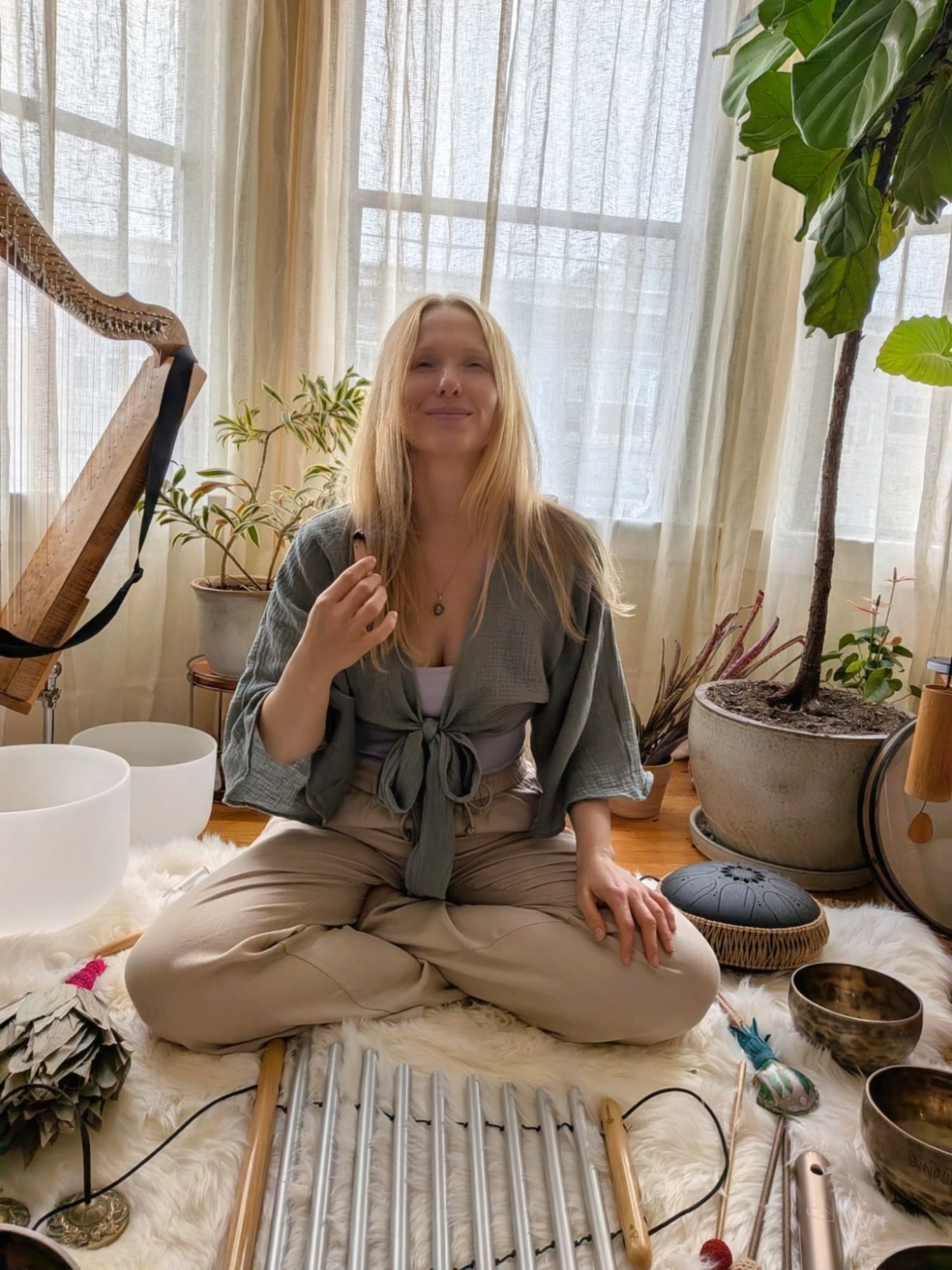 Lisa in her studio surrounded by instruments and plants